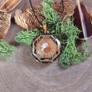 orgonite amulet yin yang zwart wit goud